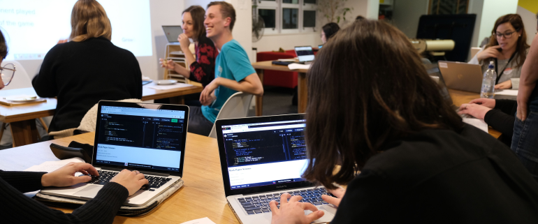 Participants write code at a Grow workshop